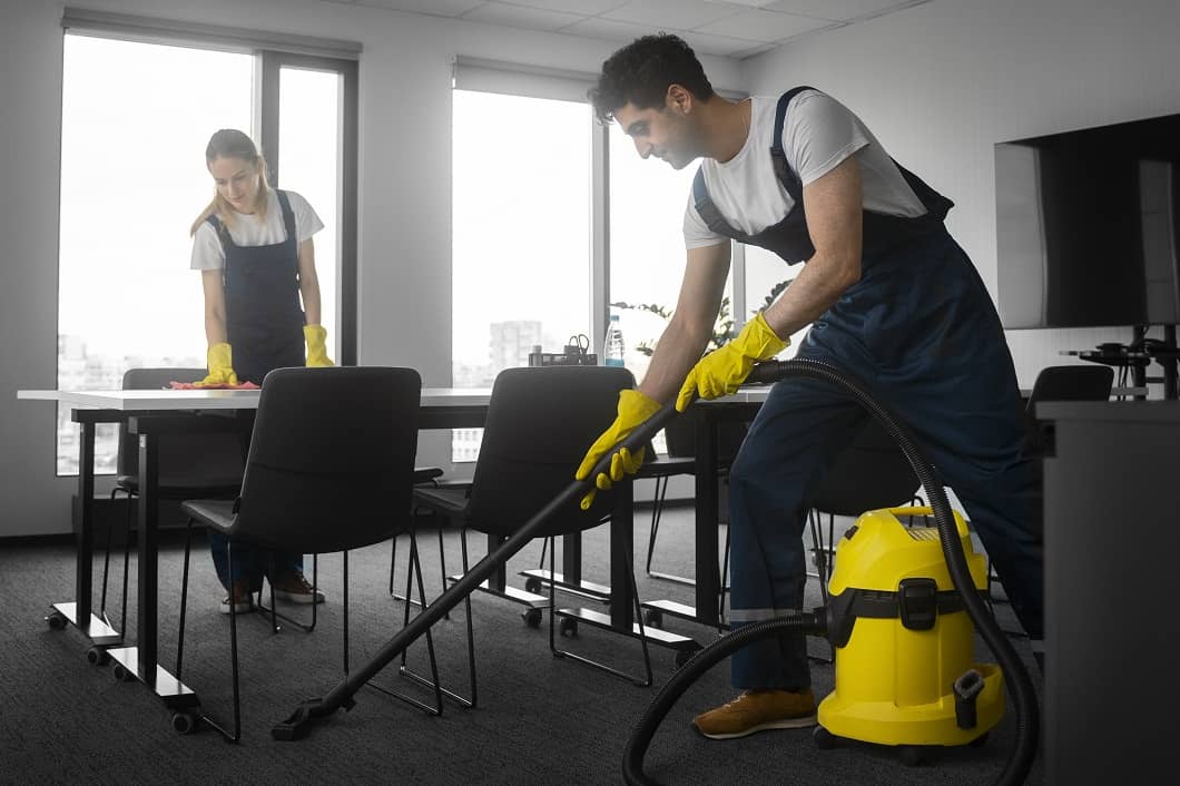 https://cleanwavecleaning.com/wp-content/uploads/2025/12/full-shot-people-cleaning-office-2.jpg