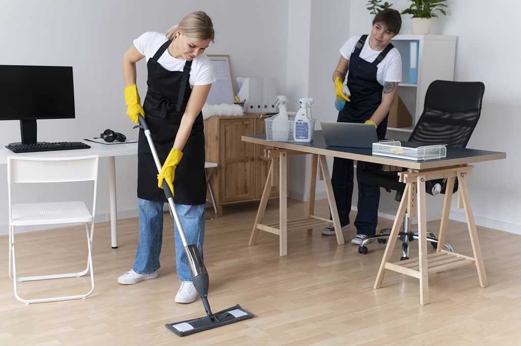 https://cleanwavecleaning.com/wp-content/uploads/2025/12/people-taking-care-office-cleaning-2.jpg